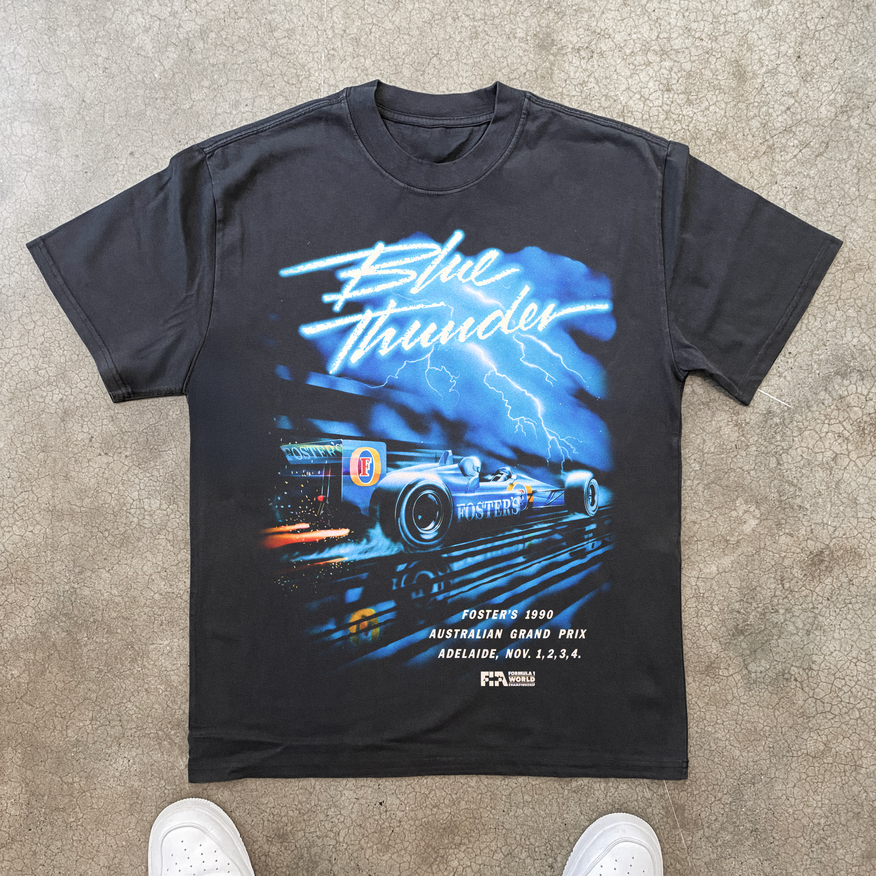 90s FOSTERS 'BLUE THUNDER' LIGHTNING GRAND PRIX HEAVY BLACK TEE Hoodie, Sweatshirt | ZylaModa.com (Image 1)