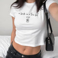 A Bride in a Tini Bit Womens Baby Tee, Bachelorette Shirt for Bride, Cute Martini Bride Top, Y2K Bridal Shower Apparel,...