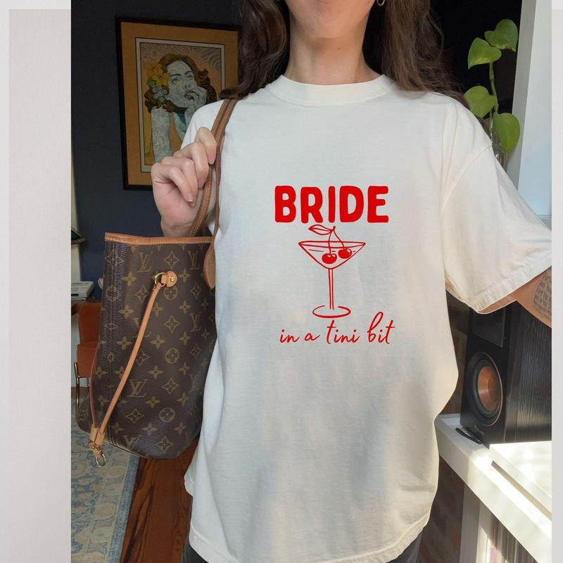 Bride in a Tini Bit Graphic T-shirt, Trendy Bachelorette Party Shirt, Gift for Bride, Wedding Day Clothing, Bride...