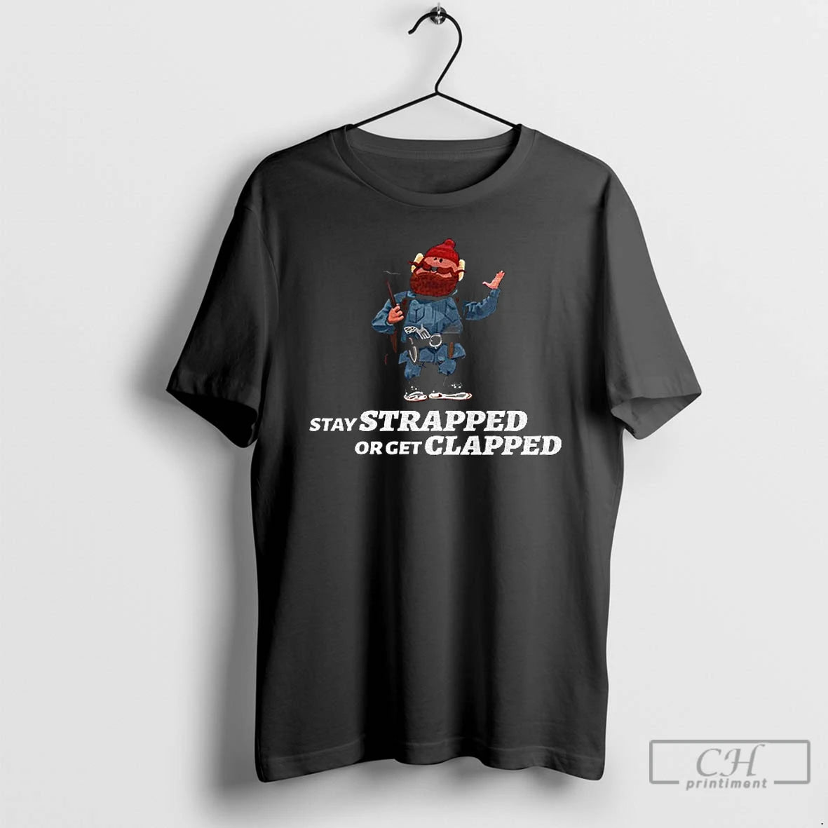 Classic Yukon Cornelius Stay Strapped Or Get Clapped T-Shirts, Hoodie, Sweatshirt | ZylaModa.com