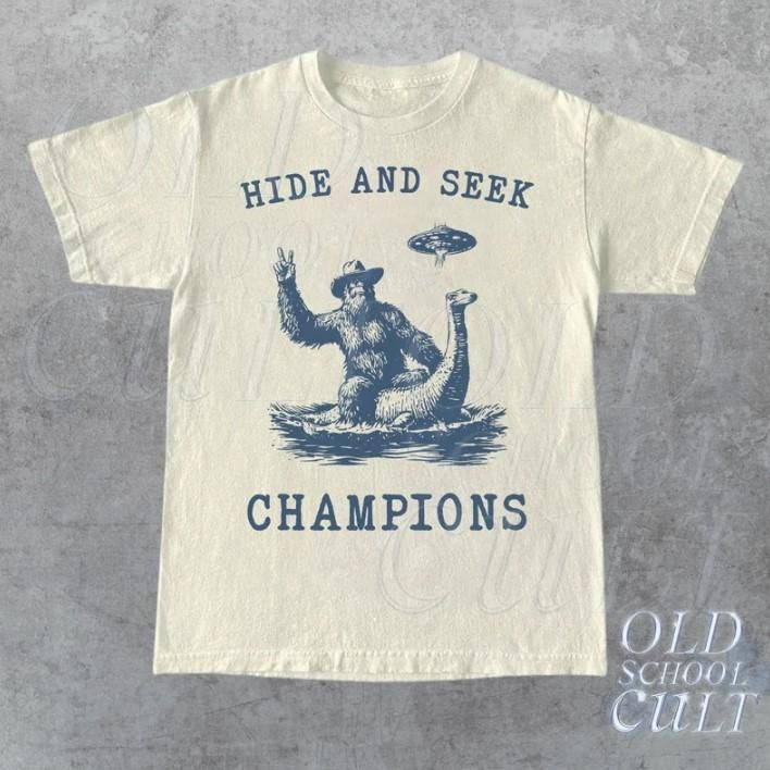 Hide And Seek Ufo Tshirt, Retro Bigfoot Shirt, Bigfoot Riding Dinosaur Shirt Hoodie, Sweatshirt | ZylaModa.com
