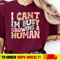 I Cant I'm Busy Growing A Human Unisex Softstyle T-Shirt Funny Pregnancy Announcement Tees For Maternity Mom Life Mothers...