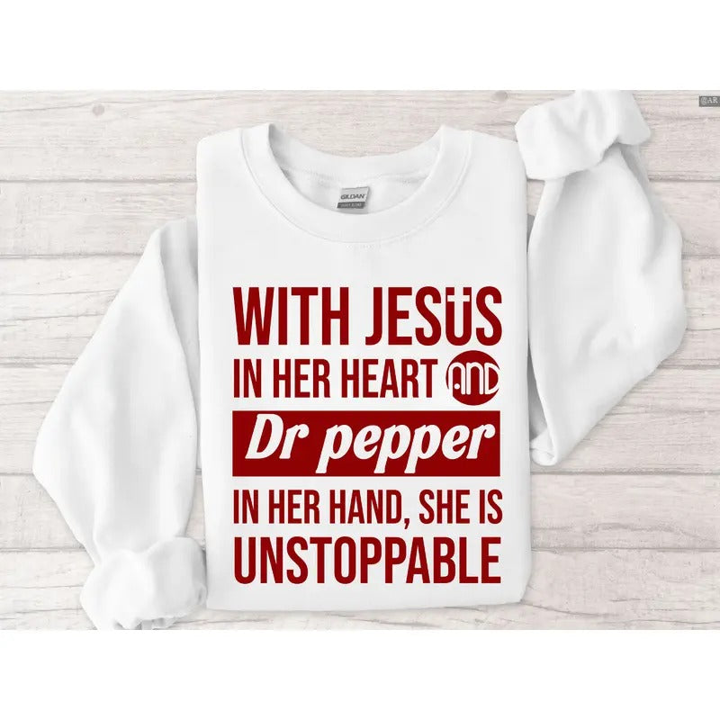 With Jesus In Her Heart And Dr Pepper In Her Hand She Is Unstoppable Sweatshirt - Hoodie